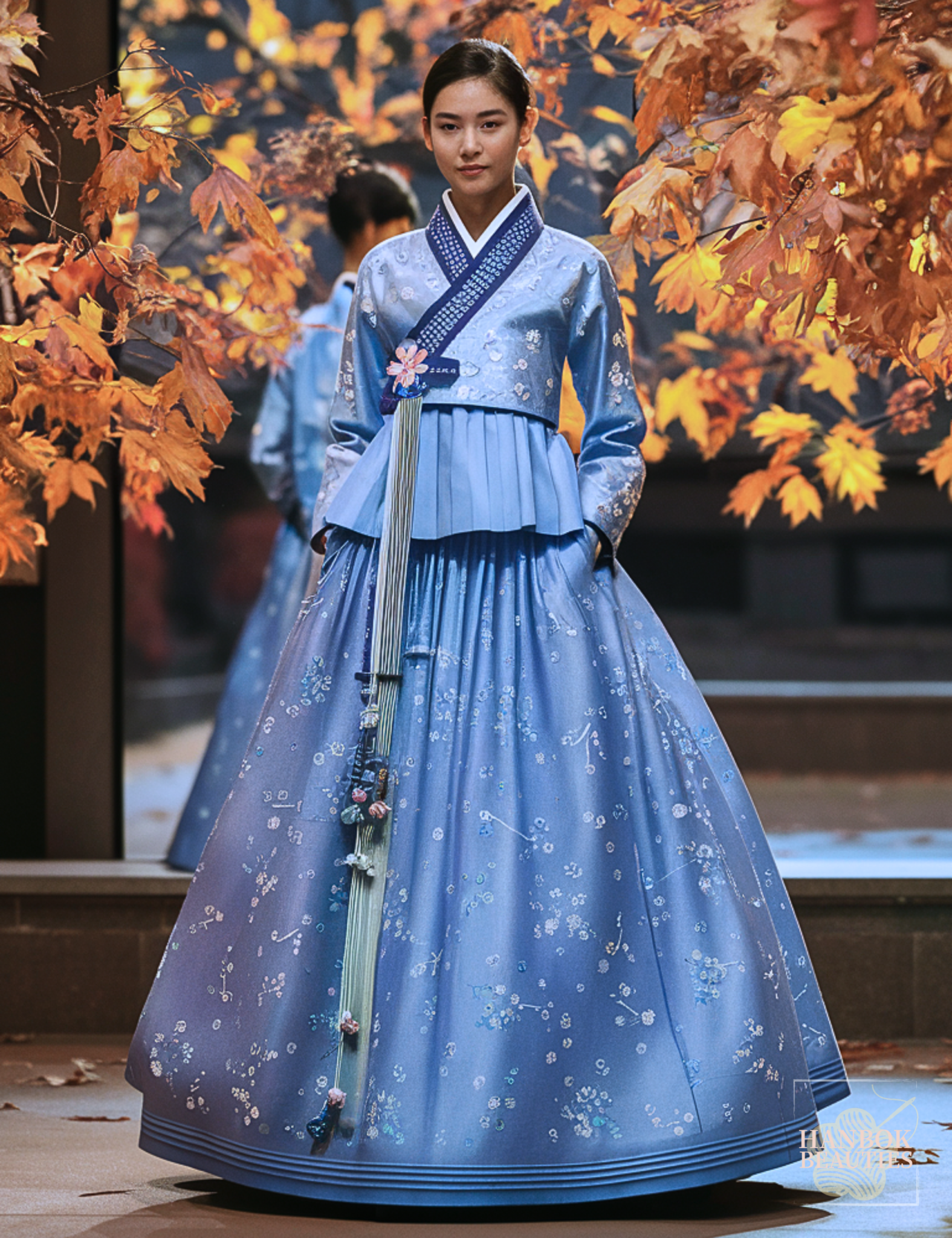 fall-seasonal-hanbok-autumn-winter-blue-floral-pleated-hanbok-beauty-elegant-pose-autumn-leaves-background