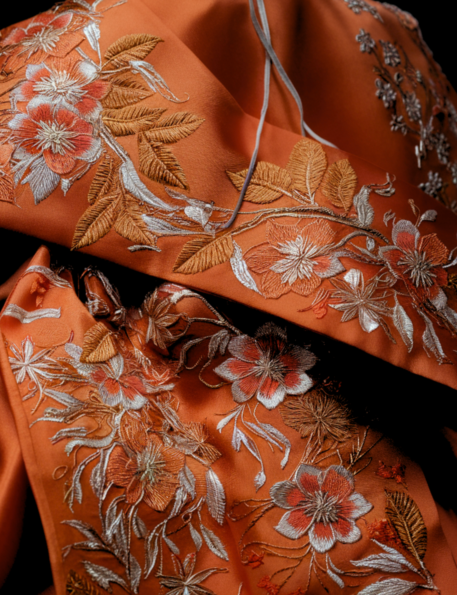 hanbok-design-orange-silk-silver-embroidery-floral-pattern-traditional-korean-autumn-metallic-detail-seasonal-craft