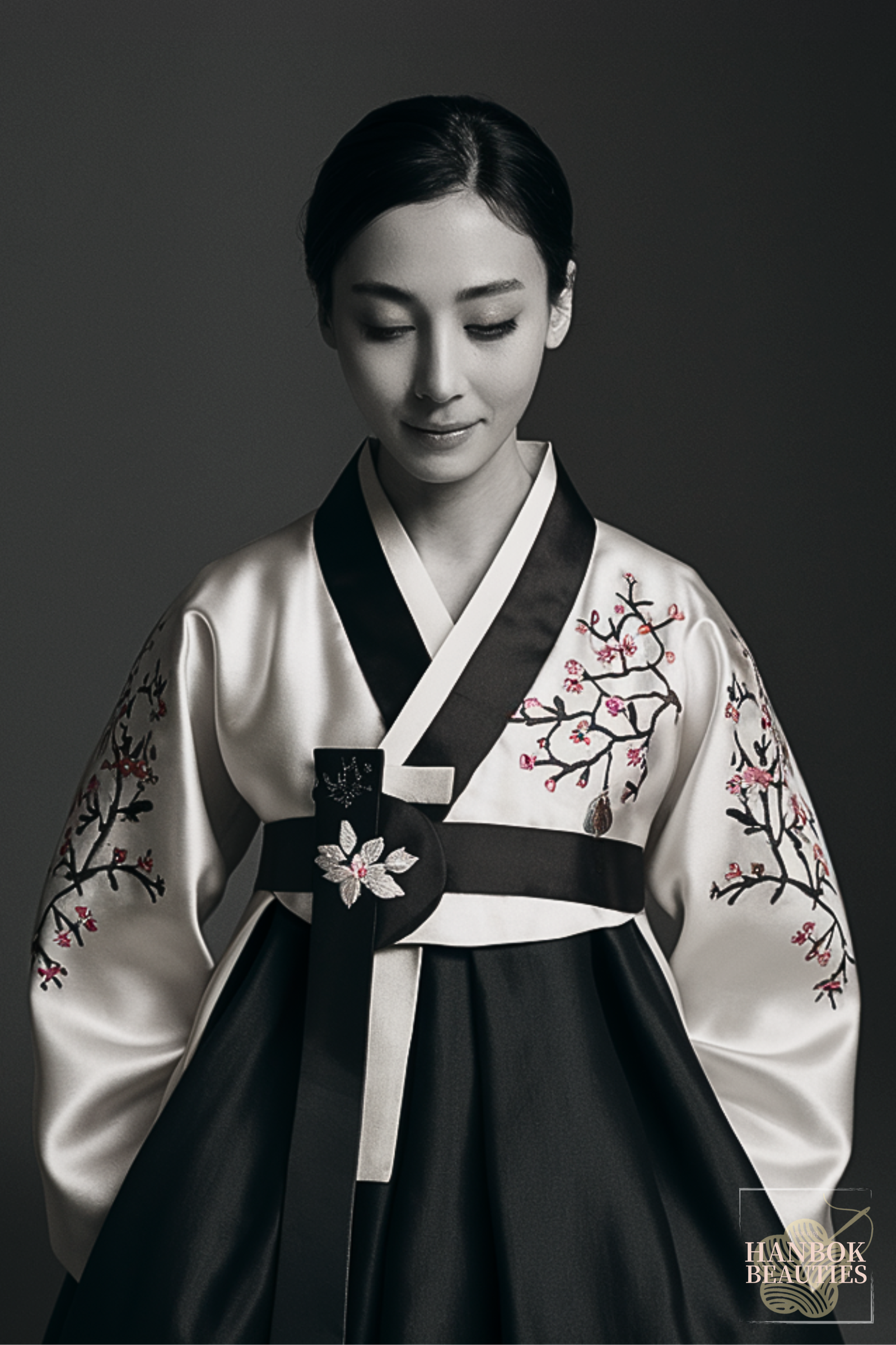 winter-womens-hanbok-design-plum-blossom-embroidery-black-white-korean-traditional-dress-portrait